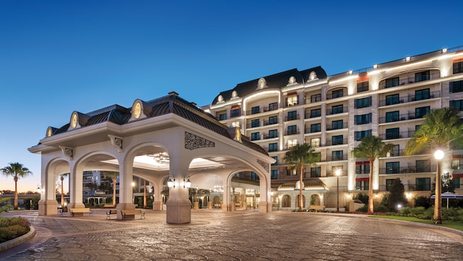 The illuminated exterior of Disney’s Riviera Resort