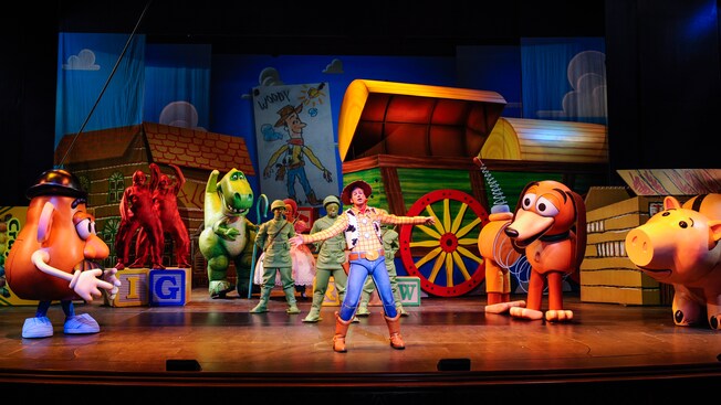 Sheriff Woody, Mister Potato Head, Slinky Dog, Rex and other Toy Story Characters play in Andys room