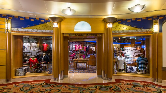 A shiny, golden doorway has a sign that identifies Treasure Ketch, a sundry store