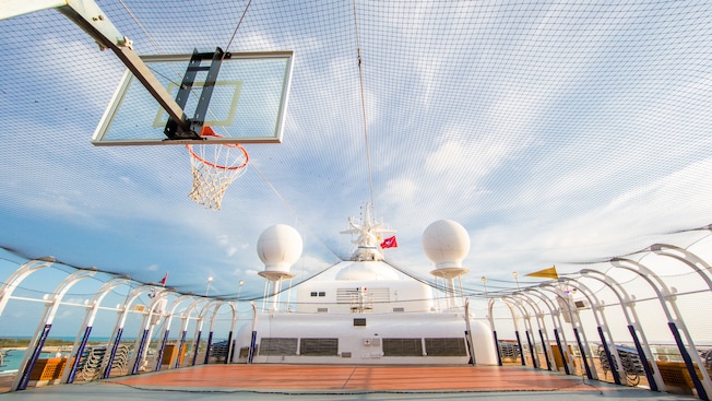 A netted outdoor basketball court A netted outdoor basketball court
