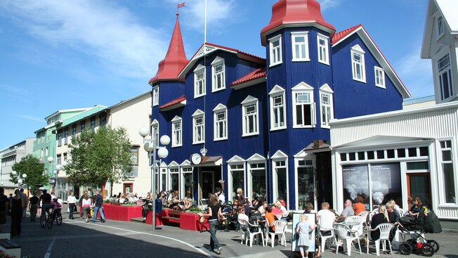 A quaint neighborhood featuring a charming Victorian style sidewalk cafe