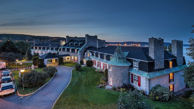 The Hotel le Manoir exterior in Baie Comeau, Quebec, is illuminated against the night sky The Hotel le Manoir exterior in Baie Comeau, Quebec, is illuminated against the night sky