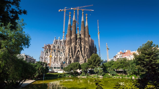 Exterior of the Basilica i Temple Expiatori de la Sagrada Familia featuring spires, the Nativity facade and more Exterior of the Basilica i Temple Expiatori de la Sagrada Familia featuring spires, the Nativity facade and more