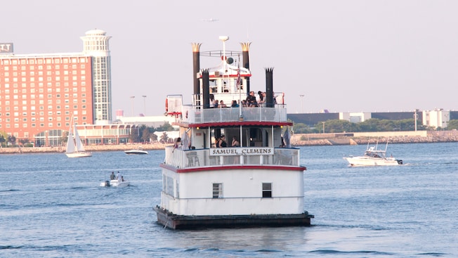 A double deck boat, identified by a sign as the Samuel Clemens, carries passengers in Boston Harbor A double deck boat, identified by a sign as the Samuel Clemens, carries passengers in Boston Harbor