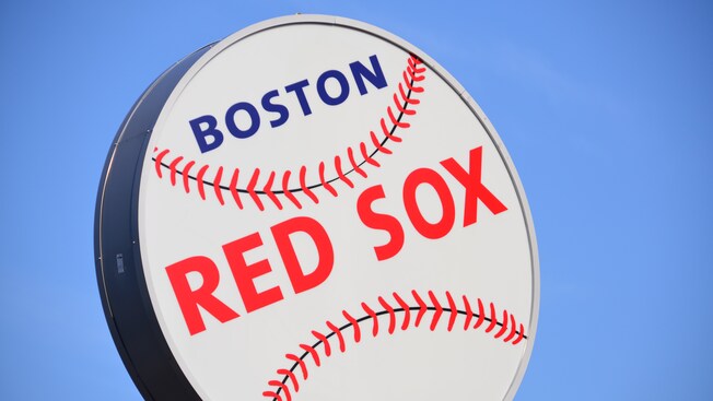 A Boston Red Sox sign in the shape of a baseball