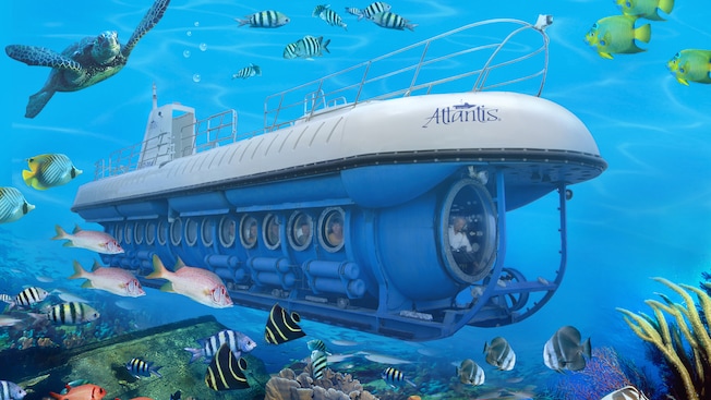 A submarine called the Atlantis is surrounded by tropical fish and other sea life A submarine called the Atlantis is surrounded by tropical fish and other sea life