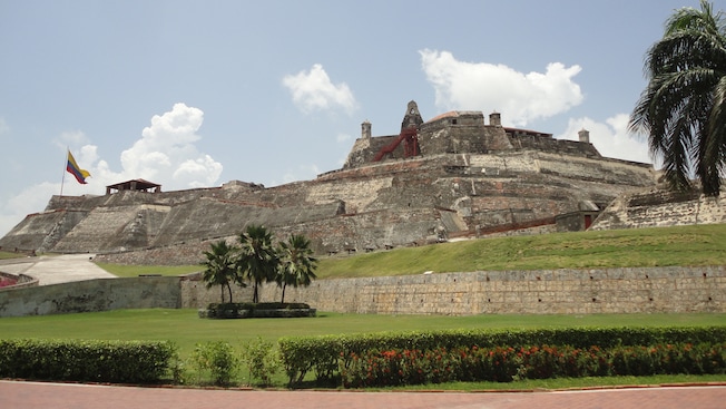 A 17th century fortress flies the Columbian flag from its position on a hill A 17th century fortress flies the Columbian flag from its position on a hill