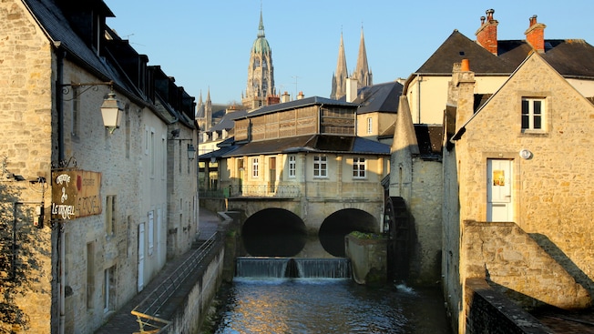 The streets of Bayeux and a flowing river The streets of Bayeux and a flowing river