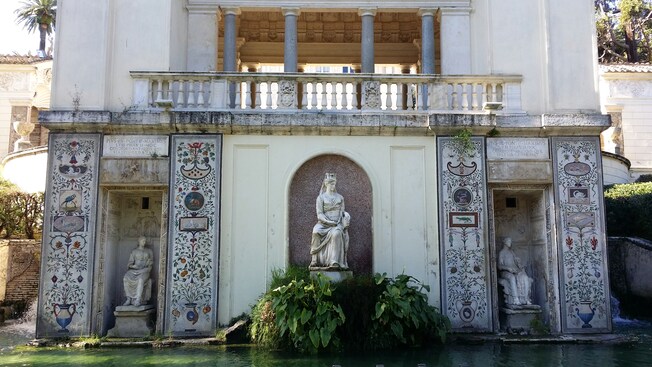 Roman sculptures surrounded by water at the Vatican Gardens