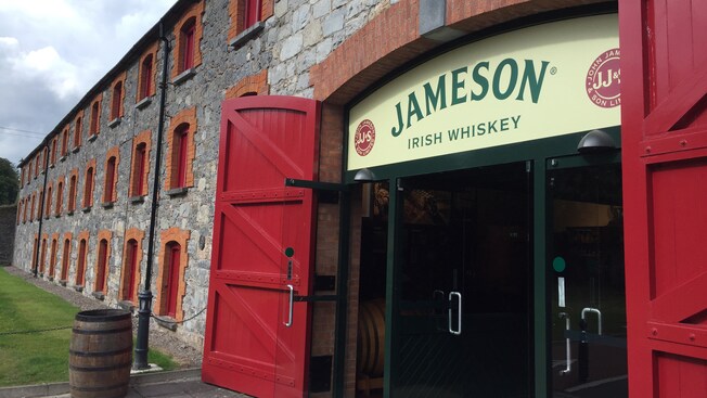 Modern glass doors at the entrance of the historic building for Jameson Irish Whiskey