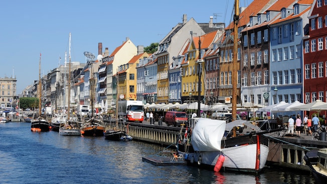 Historical townhouses and wooden boats line the Nyhavn waterfront Historical townhouses and wooden boats line the Nyhavn waterfront