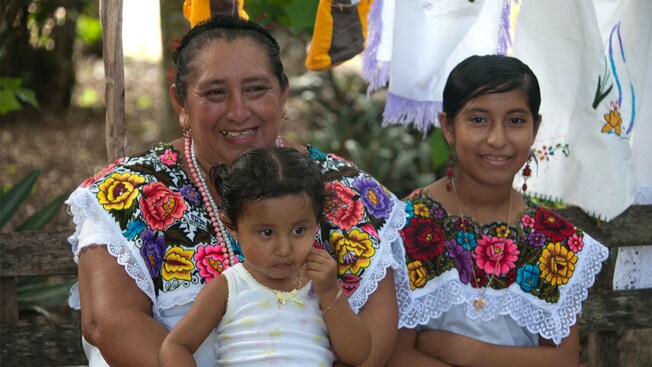 A Mayan woman and her granddaughters