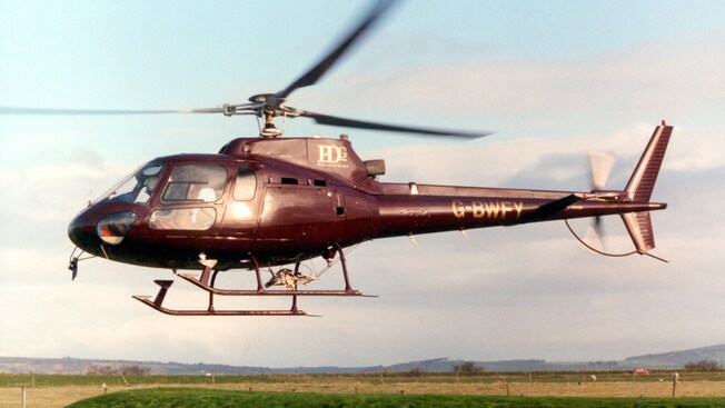 A helicopter hovering above the ground