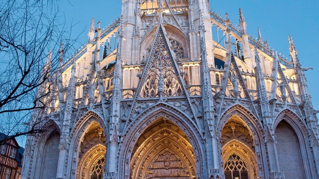 A soft glow emanating from Rouen’s cathedral at dusk