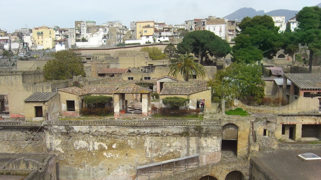 The ruins of ancient Herculaneum stand below street level of the modern day city The ruins of ancient Herculaneum stand below street level of the modern day city