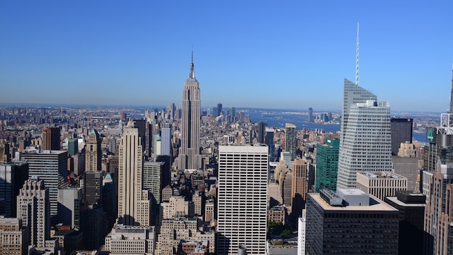 Skyscrapers, high rises and other tall buildings of wide variety completely cover a peninsula Skyscrapers, high rises and other tall buildings of wide variety completely cover a peninsula