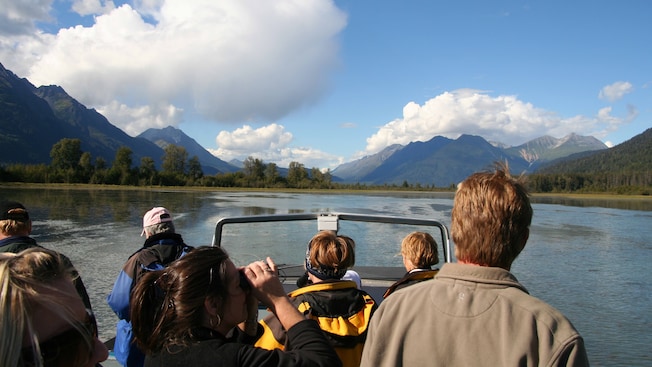 A tour group on a boat in the waters of the Alaskan wilderness A tour group on a boat in the waters of the Alaskan wilderness