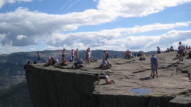 Visitors take in the views from the top of Pulpit Rock, Norway Visitors take in the views from the top of Pulpit Rock, Norway
