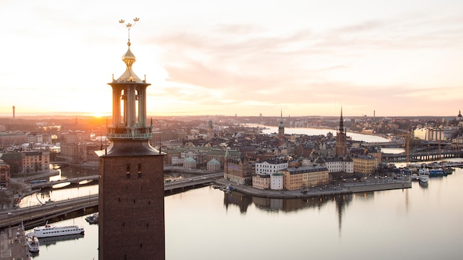 A square tower, with 3 golden crowns at its pinnacle, rises above Stockholm, Sweden A square tower, with 3 golden crowns at its pinnacle, rises above Stockholm, Sweden