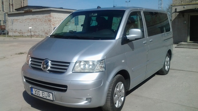 A Volkswagen van with tinted windows A Volkswagen van with tinted windows