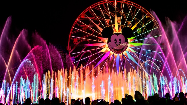 The fountains, lasers and projections at the World of Color nighttime spectacular light up the night sky