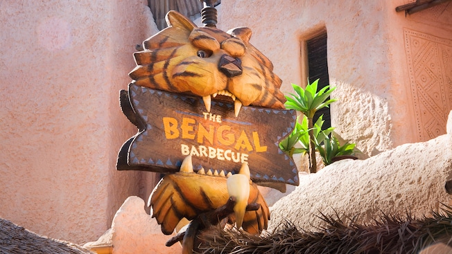 Sign with wood carving of a tigerâs head, The Bengal Barbecue restaurant in Disneyland Park