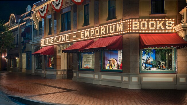 Patriotic flag banners cascade from the storefront as lights outside the Emporium illuminate the night