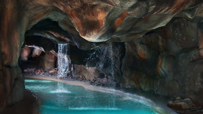 A grotto with refreshing waterfalls in Cross Country Creek at Disney's Blizzard Beach