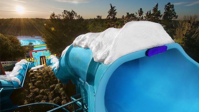 Twin enclosed waterslides wait for riders in Disney's Blizzard Beach at sunrise