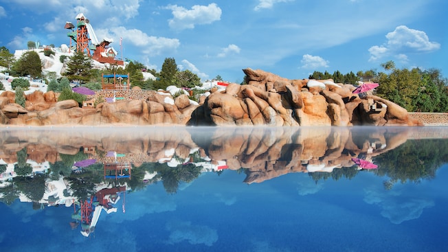 Calm waters in Melt-Away Bay reflect the water park's Mount Gushmore