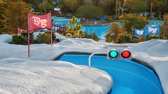 The starting gate at Snow Stormers with a red and a green and a view of Melt-Away Bay below