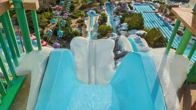 The top of Summit Plummet waterslide with a partial view of other attractions at the water park
