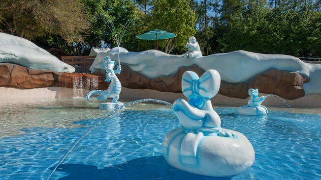 Ice sculptures, including one of Ice Gator, squirt water at Tike's Peak