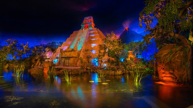 A large stone pyramid, a volcano and a stone Olmec head in the opening scene at Gran Fiesta Tour Starring The Three Caballeros