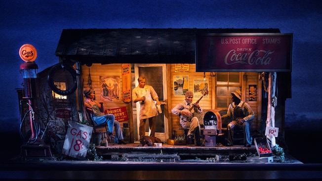 Four men and a dog on a porch in a 1929 gas station scene at The American Adventure at Epcot
