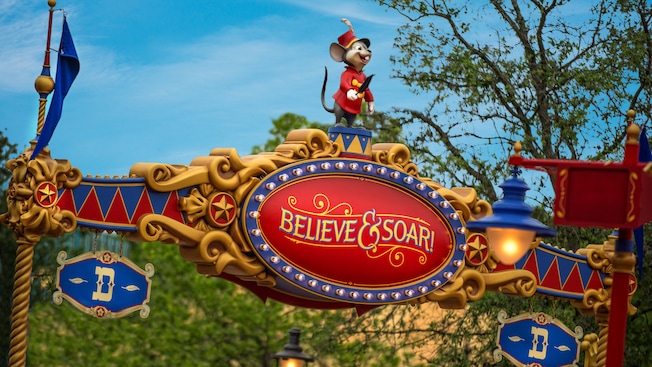 The entrance to Dumbo the Flying Elephant with Timothy Q. Mouse and the sign: 'Believe & Soar!'
