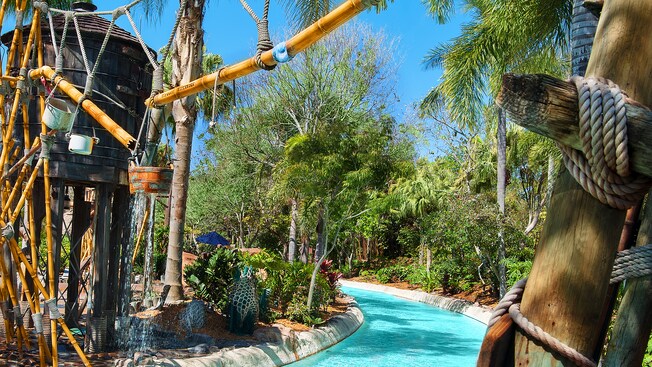Castaway Creek curving around a water tower and a broken waterline overhead