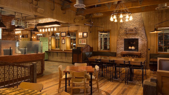 Eclectic décor, rustic lighting, and brick and wood accents color the eating area at D-Luxe Burger