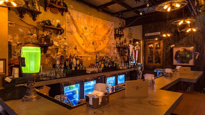 A map of the world hangs over the extensive selection of beverages at Jock Lindsey’s Hangar Bar