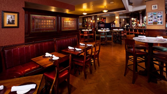 Banquette tables against the wall in an alternate dining area