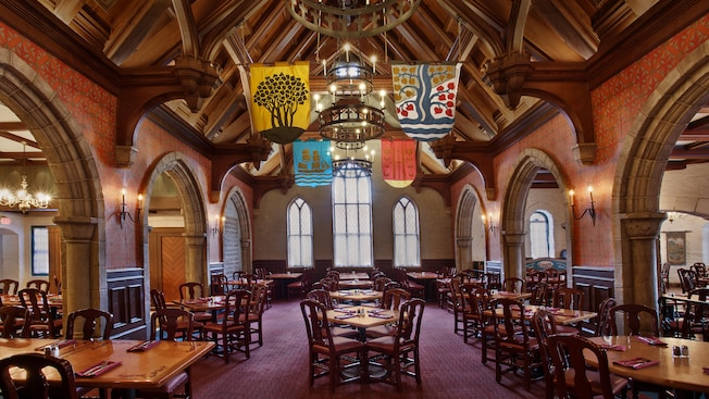 Heraldic banners hang from the rafters of the main dining room at Akershus Royal Banquet Hall
