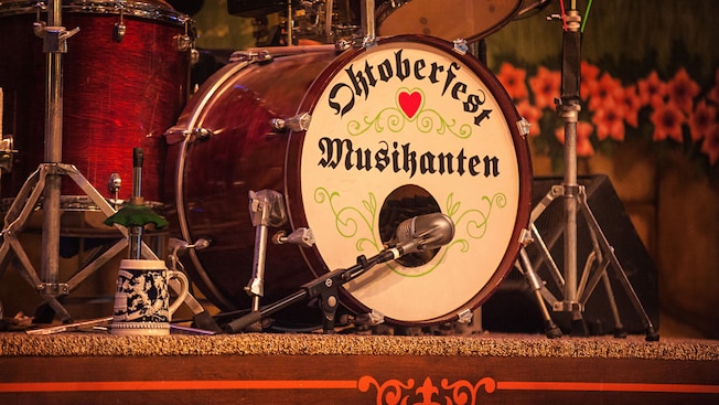 A drum set on stage with 'Oktoberfest Musikanten' written on the bass drum