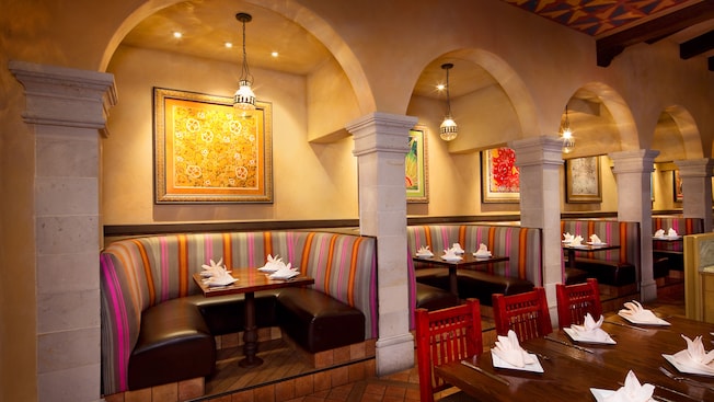 4 booths in alcoves with overhead hanging globe lights