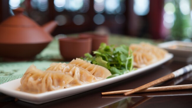 General Tso's chicken dumplings with cilantro garnish