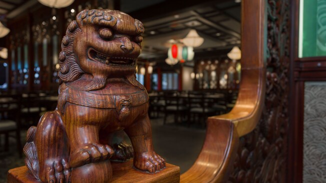 Close-up of wood-carved Chinese lion statue