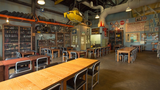 Dining tables and chairs, movie props and a yellow submarine hanging from the ceiling
