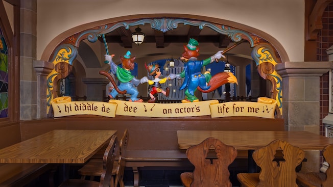 Tables behind 3D figures of Gideon, Pinocchio and Honest John