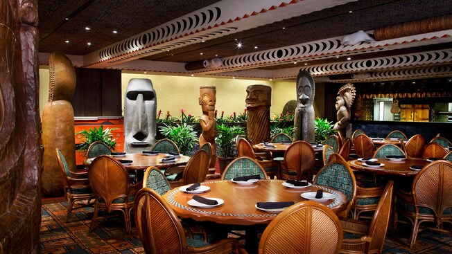While you dine, enjoy the relaxing ambiance of this Polynesian-themed setting, complete with wooden tiki carvings.