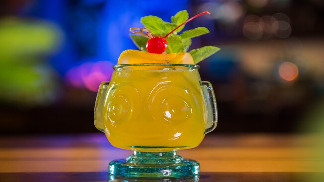 A HippopotoMai-Tai specialty cocktail from Trader Sam's Grog Grotto is served in a souvenir tiki glass