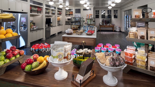 A room displaying food and beverage options including packaged desserts, fruit, soda and more